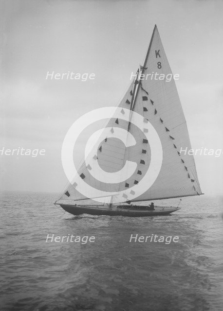 The 7 Metre sailing yacht 'Pinaster' (K8) with prize flags, 1912. Creator: Kirk & Sons of Cowes.