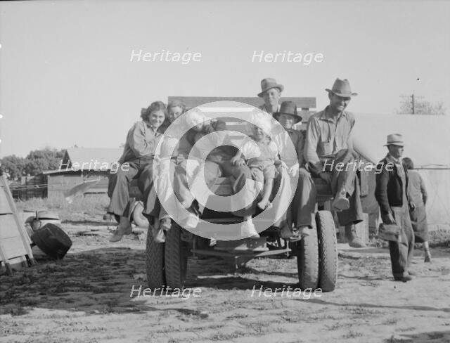 California pea pickers returning to camp..., near Santa Clara, California, 1937. Creator: Dorothea Lange.
