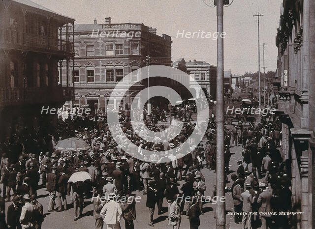 South Africa: a crowd of people gathered for trading in a chained off area outside the..., 1896. Creator: Barnett.