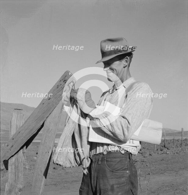 Farmer getting the morning mail, Gem County, Idaho, 1939. Creator: Dorothea Lange.