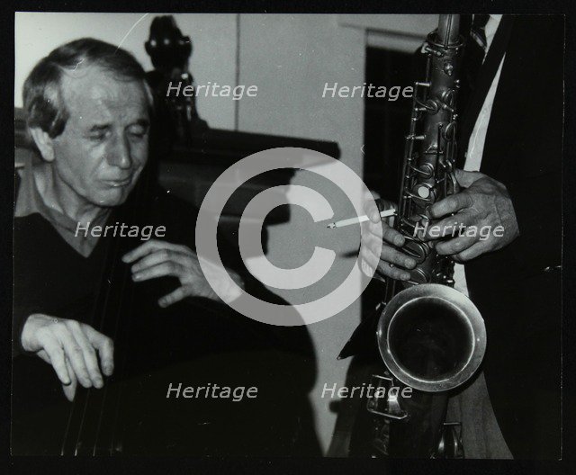 Phil Bates and the tenor saxophone of Spike Robinson at The Bell, Codicote, Hertfordshire, 1986. Artist: Denis Williams