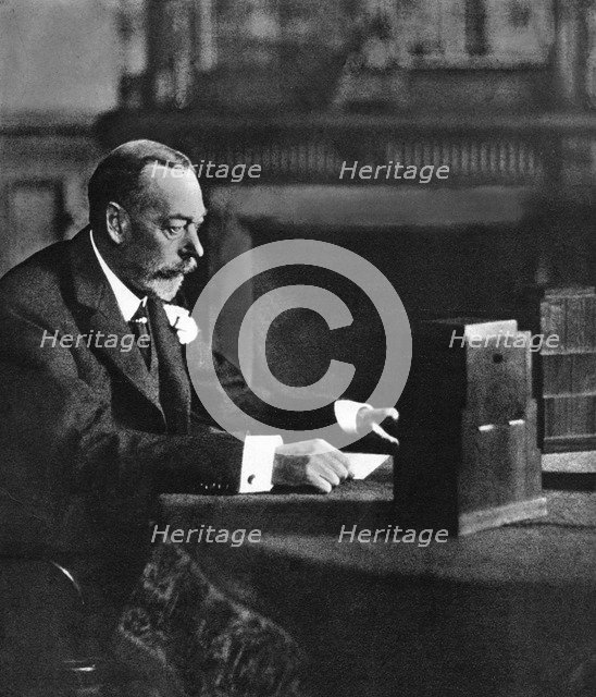King George V broadcasting to the empire on Christmas Day, Sandringham, 1935. Artist: Unknown