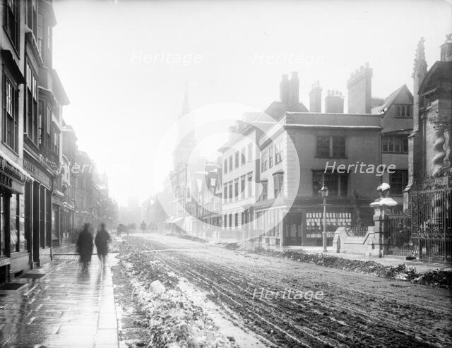 A view down the High Street with snow and slush in the road, Oxford, Oxfordshire, 1885. Creator: Henry Taunt.