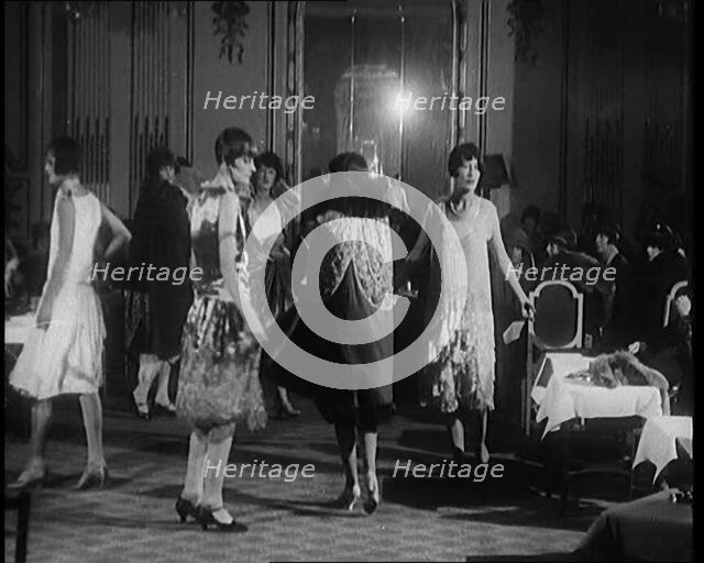 A Group of Female Civilians Modelling Various Glamorous Outfits in a Fashion Parade, 1920. Creator: British Pathe Ltd.
