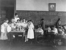 Classroom scene in Washington, D.C. elementary school - children working with blocks..., (1899?). Creator: Frances Benjamin Johnston.