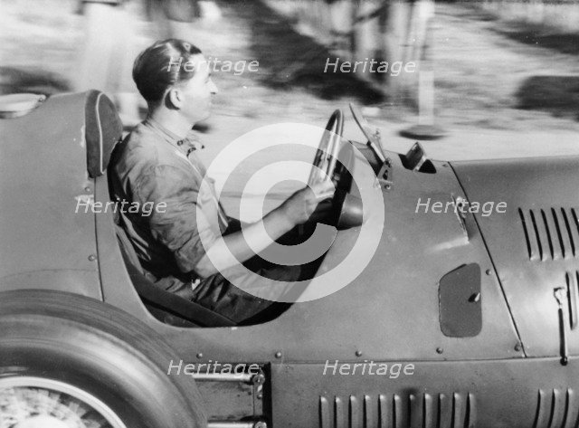 Alberto Ascari at the wheel of a racing car. Artist: Unknown