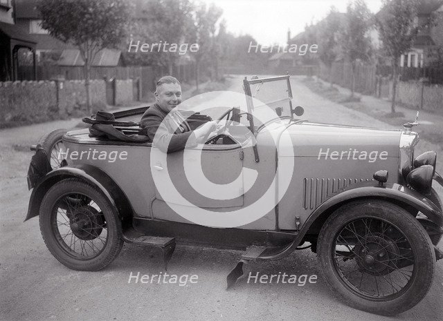 FA Thatcher behind the wheel of a 1929 Triumph Super Seven open four-seater. Artist: Bill Brunell.