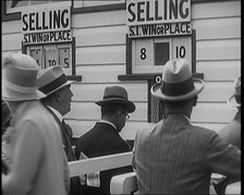 A Crowd of People Standing Outside a Totaliser/Tote Office at a Horse Race Course..., 1929. Creator: British Pathe Ltd.