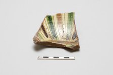 sherd, red body, white slip; green, brown, yellow striped glaze, Mamluk period, 1250-1516. Creator: Unknown.