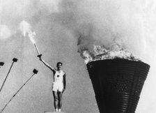 Yoshinori Sakai lights the Olympic cauldron, Summer Olympic Games, Tokyo, 1964. Artist: Unknown