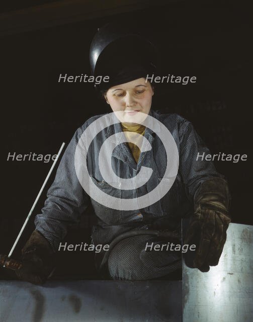 Enola O'Connell, age 32, widow and mother of one child...Heil and Co., Milwaukee, Wisconsin, 1943. Creator: Howard Hollem.