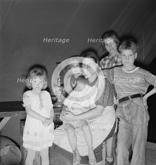 Family of six in tent after supper, FSA mobile unit, Merrill, Klamath County, Oregon, 1939 Creator: Dorothea Lange.