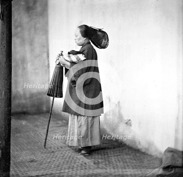 Canton, Kwangtung province, China: a lady holding a parasol, 1869. Creator: John Thomson.