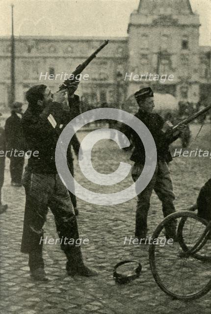 Belgian military cyclists shooting at a German plane, First World War, 1914-1918, (c1920). Creator: Unknown.