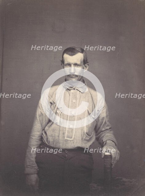 Man Holding Patent Office Book, ca. 1857. Creator: Attributed to Oliver H. Willard.