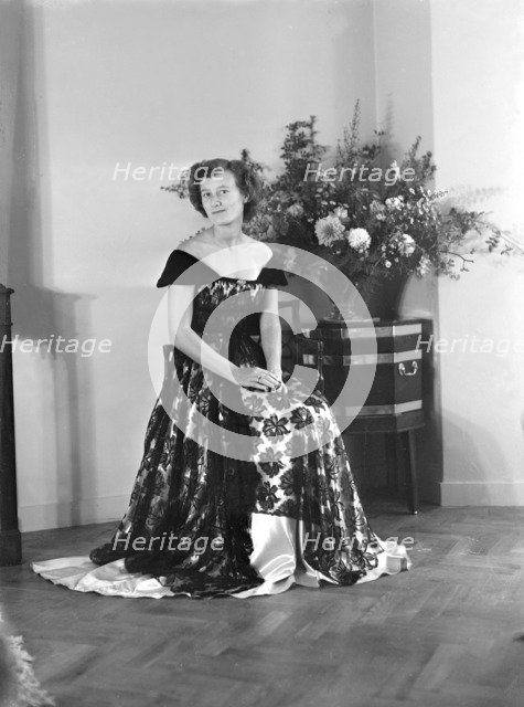 Portrait of seated woman in evening dress, (Isle of Wight?), c1935.  Creator: Kirk & Sons of Cowes.