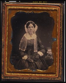 Unidentified woman, three-quarters length portrait, seated with left arm resting..., ca. 1855. Creator: Francis Grice.