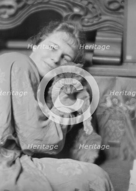 Cutler, Miss, with Buzzer the cat, portrait photograph, 1915 May 26. Creator: Arnold Genthe.