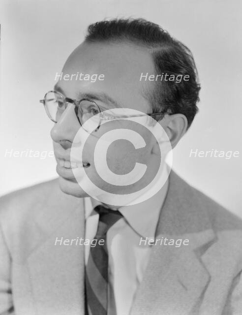 Portrait of Ahmet M. Ertegun, William P. Gottlieb's home, Arlington, Va.(?), 1930. Creator: William Paul Gottlieb.