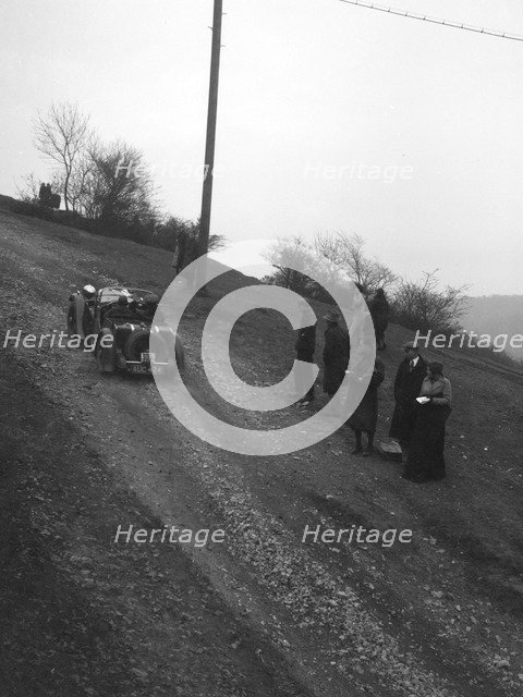Singer of CV Glass climbing Nailsworth Ladder, Sunbac Colmore Trial, Gloucestershire, 1934. Artist: Bill Brunell.