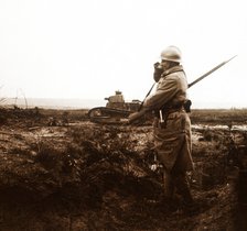 Tank and soldier on battlefield, c1914-c1918. Artist: Unknown.
