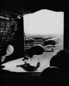 Putting barrage ballons into a hangar, 1943. Artist: Unknown.