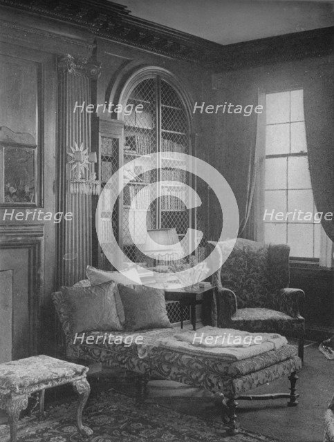 Comfortable corner in the library showing bookcase, house of Miss Anne Morgan, New York City, 1924. Artist: Unknown.