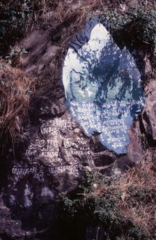 Tibetan script painted on rocks, Dharamsala, India, 1988. Creator: Amanda Waite.