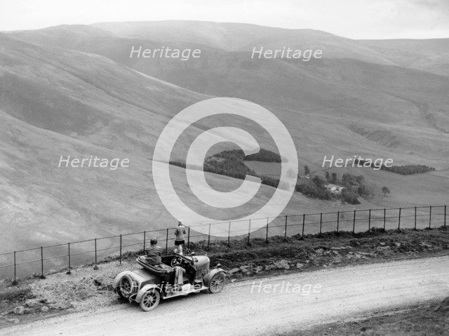 People with a Morris Cowley at the Devil's Beef Tub, Scotland, (c1930s?). Artist: Unknown