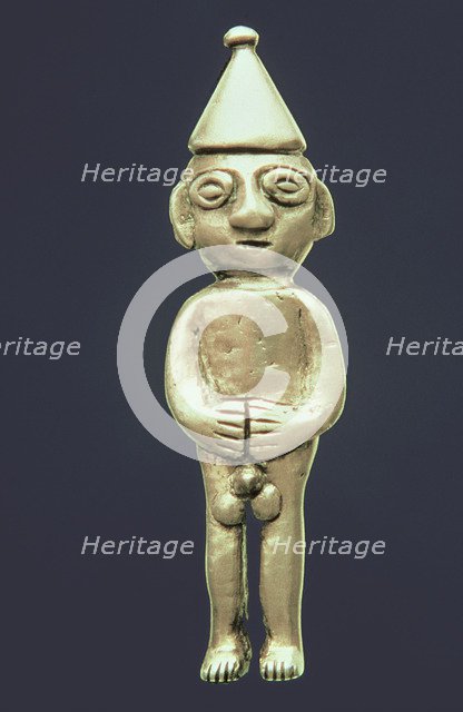 Anthropomorphic figure made of silver representing a male person standing with his hands on the b…