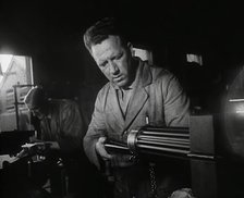 British Factory Workers Making a Machine Gun, 1941. Creator: British Pathe Ltd.