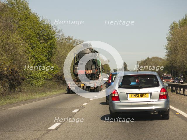 Locomotive being transported by heavy goods vehicle on A31 2015. Creator: Unknown.