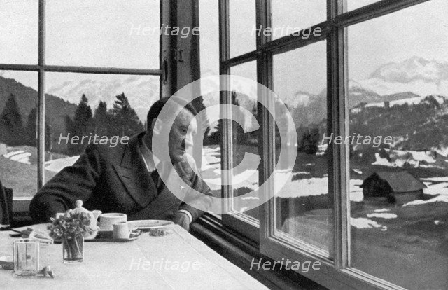 Adolf Hitler admiring the view out a window near Garmisch, Bavaria, Germany, 1936. Artist: Unknown