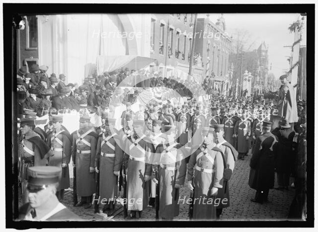 Parade with President Woodrow Wilson and Mrs. Wilson on reviewing stand, between 1910 and 1914. Creator: Harris & Ewing.