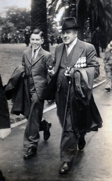 Frank Page with his son, Thomas. Creator: Unknown.