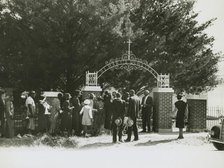 On All Saints' Day at New Roads, La. African Americans lined up at gates to enter cemetry, 1938. Creators: Farm Security Administration, Russell Lee.