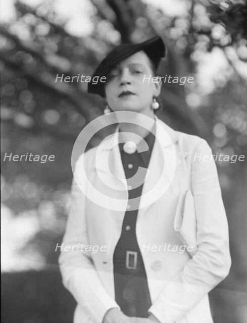 Leonard, Mrs., standing outdoors, between 1926 and 1938. Creator: Arnold Genthe.