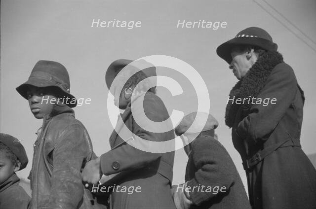 Possibly: Negroes in the lineup for food at mealtime in the camp..., Forrest City, Arkansas, 1937. Creator: Walker Evans.