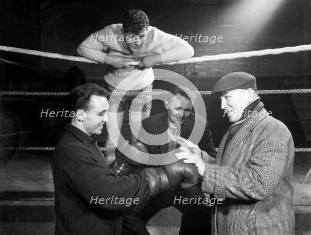 A miner from Sunderland gets some ringside boxing advise, Newcastle, 1964.  Artist: Michael Walters