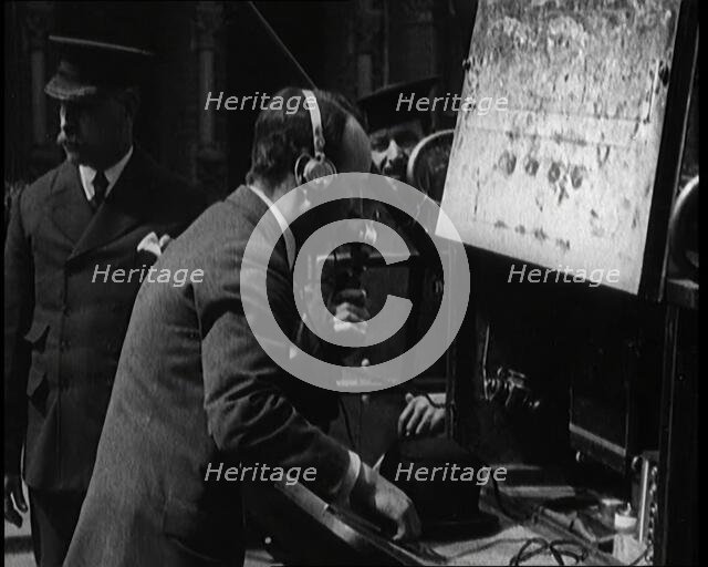 British Radio Operator Working at the Rear of a Fire Engine, 1920. Creator: British Pathe Ltd.