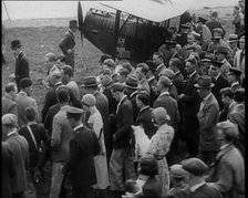 Jim Mollison Walking to His Plane With a Large Crowd, 1930s. Creator: British Pathe Ltd.