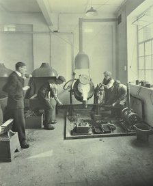 Men pouring molten metal in a foundry, School of Engineering and Navigation, London, 1931. Artist: Unknown.