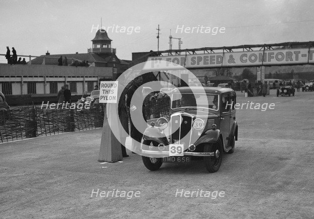 Standard Nine saloon competing in the JCC Rally, Brooklands, Surrey, 1939. Artist: Bill Brunell.