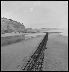 View looking north-east of Shanklin Beach, showing Admiralty scaffolding, Isle Of Wight, 1945. Creator: George R Long.