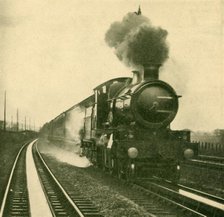 'An Engine of the Star Class Picking Up Water at Speed, Goring, Great Western Railway', 1930. Creator: Unknown.