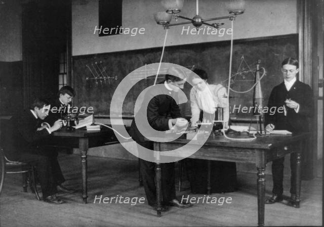Students in a science class conducting experiments, Western High School, Washington, D.C., (1899?). Creator: Frances Benjamin Johnston.