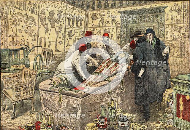 Howard Carter and Lord Carnarvon with Coffin of Tutankhamun. Creator: Anonymous.