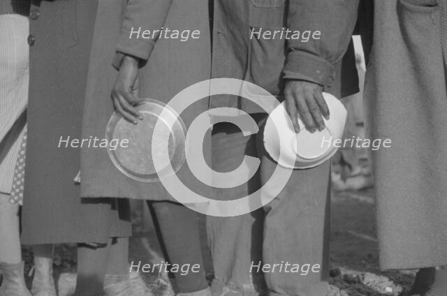 Possibly: Negroes in the lineup for food at mealtime in the camp..., Forrest City, Arkansas, 1937. Creator: Walker Evans.
