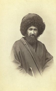 Half-length portrait of Georgian muezzin, facing front, between 1870 and 1886. Creator: Unknown.