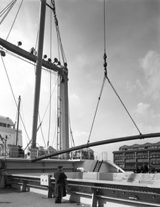 Steel bars being loaded onto the 'Manchester Renown', Manchester, 1964. Artist: Michael Walters